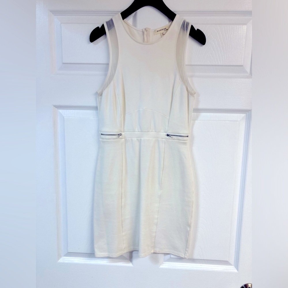 Monteau mini dress with silver zipper and subtle netting detail.